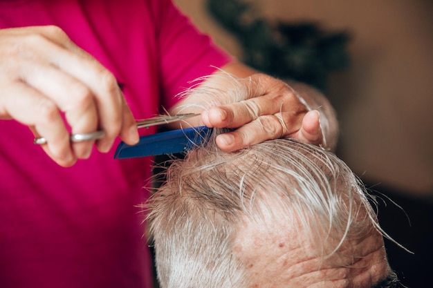 Old man getting a haircut