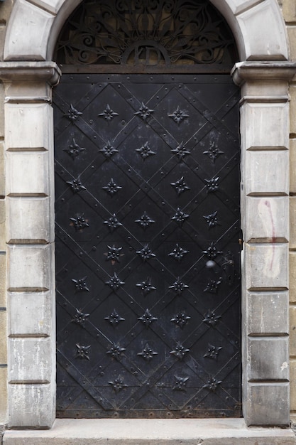 Old massive swinging metal forged doors