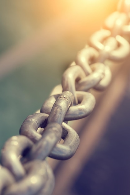 Old metal chain on a blurred background Toned