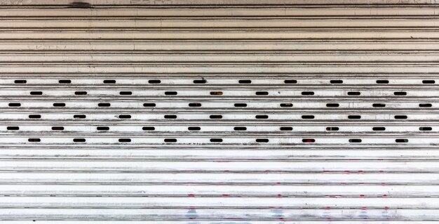 Photo old metal roller shutter texture background white color