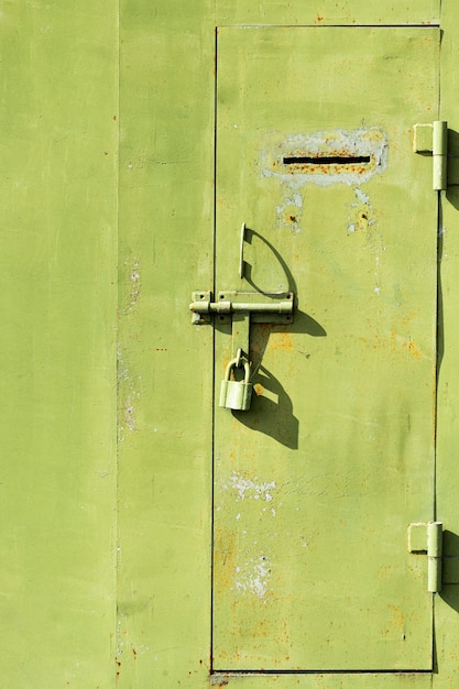 Old metallic door with keypad