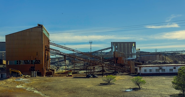 Old mining complex of Riotinto with mineral conveyor belts and old mining buildings