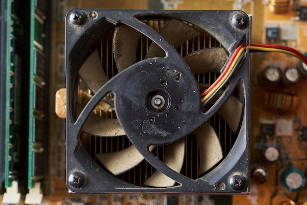 Old motherboard covered in dust and dirt Closeup