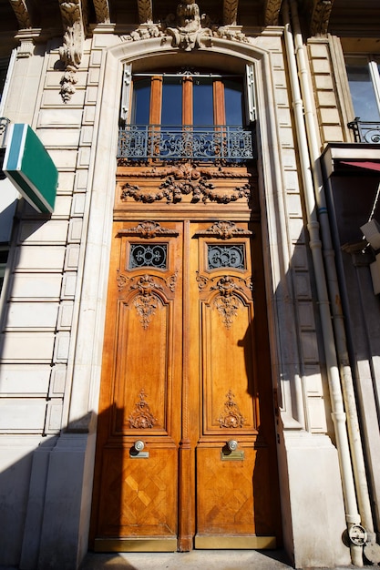 Old ornate door in Paris France typical old apartment building