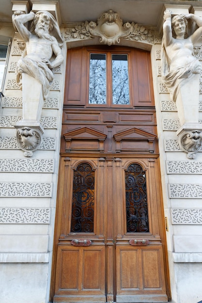 Old ornate door in Paris France typical old apartment building