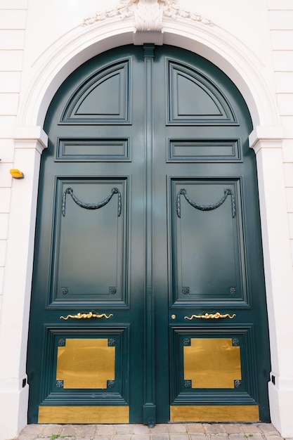 Old ornate door in paris france typical old apartment building