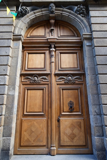 Old ornate door seen in Saint Malo typical old apartment buildiing