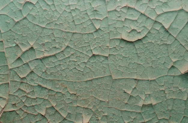 Old painted wall with cracked paint