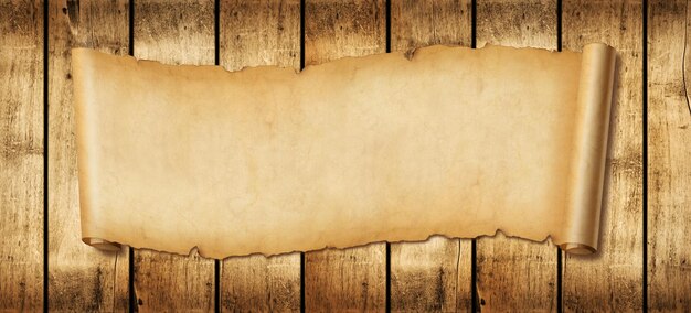 Old paper horizontal banner Parchment scroll on a wood board