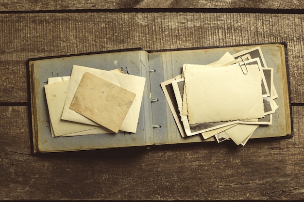 Old photos on the wooden table