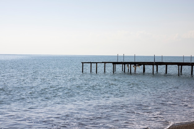 Old pier and blue sea