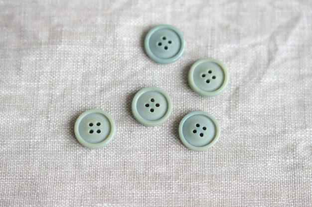 Old plastic buttons in different colors on the background. tinting