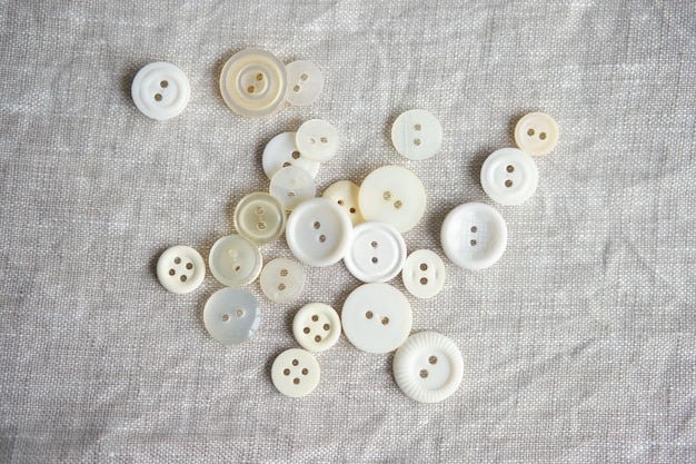 Old plastic buttons in different colors on the background. tinting