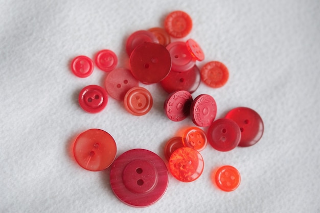 Old plastic buttons in different colors on the background. tinting