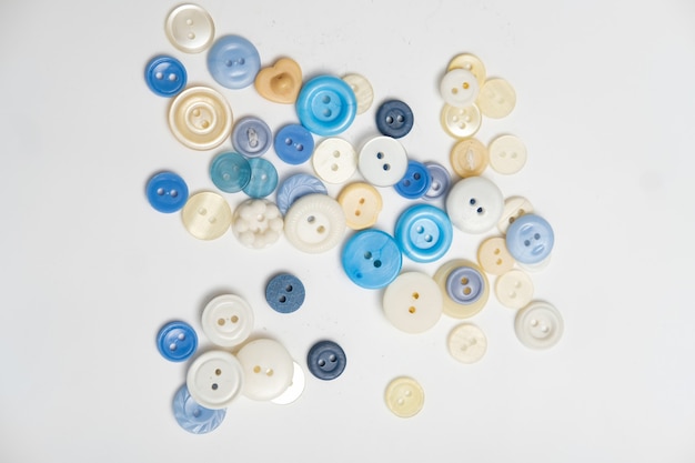 Old plastic buttons in different colors on the background. tinting