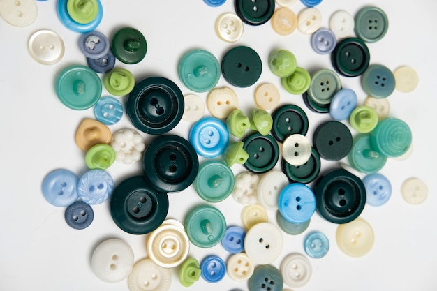 Old plastic buttons in different colors on the background. tinting