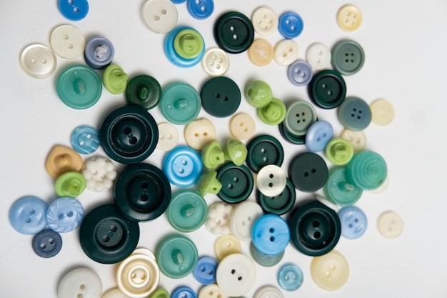 Old plastic buttons in different colors on the background. tinting