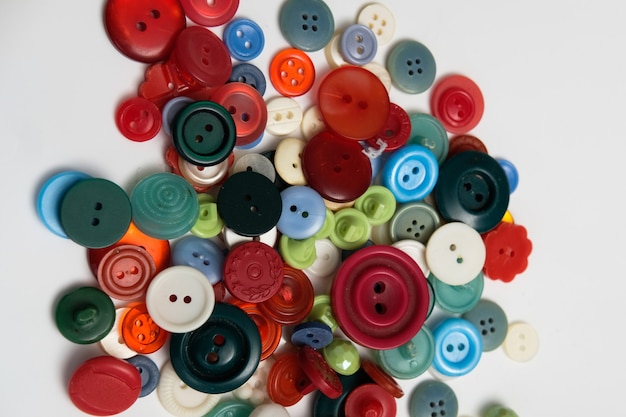 Old plastic buttons in different colors on the background. tinting