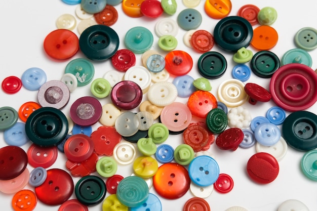 Old plastic buttons in different colors on the background. tinting