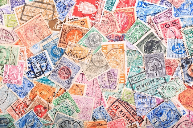 Old postage stamps from various countries as background