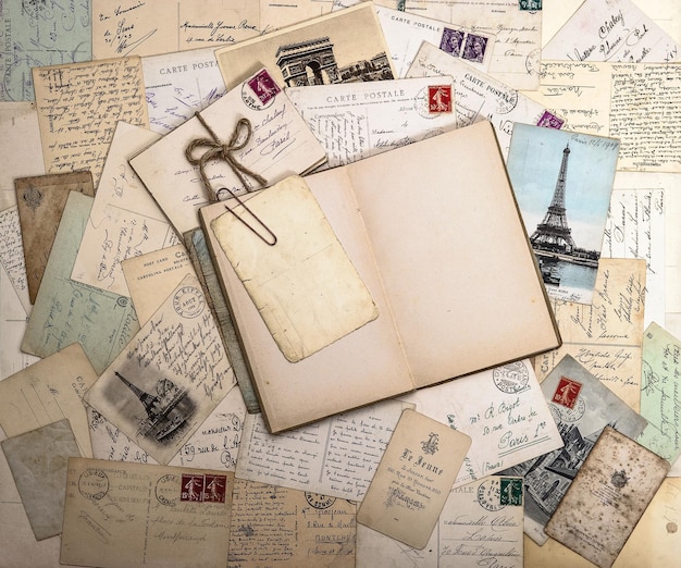 Old postcards and open book nostalgic vintage background