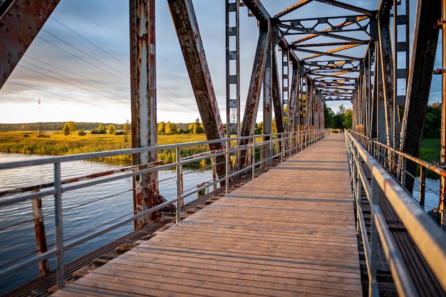 Old railway bridge converted into a pedestrian bridge Sunset