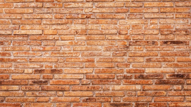 Old red brick wall background. 