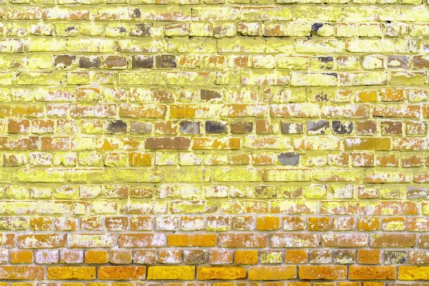 Old red brick wall Peeling white paint on a red wall