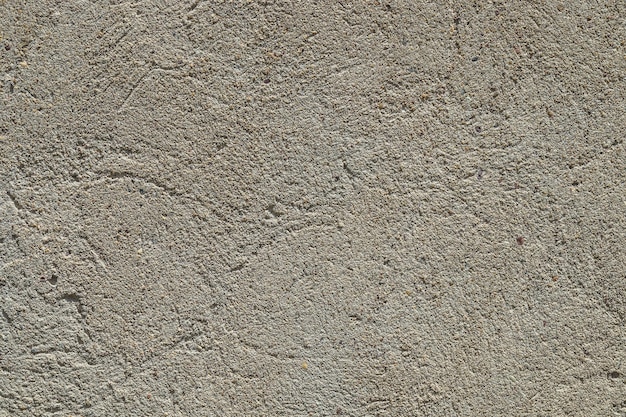 Old rough eroding cement surface as background