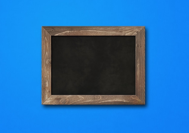 Old rustic black board isolated on blue