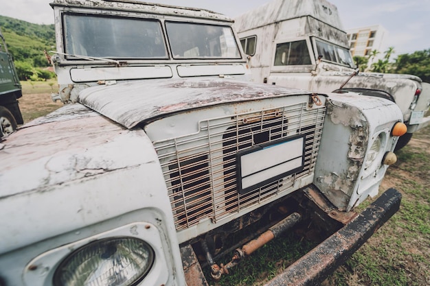 Old rusty cars for safari in the jungle of africa