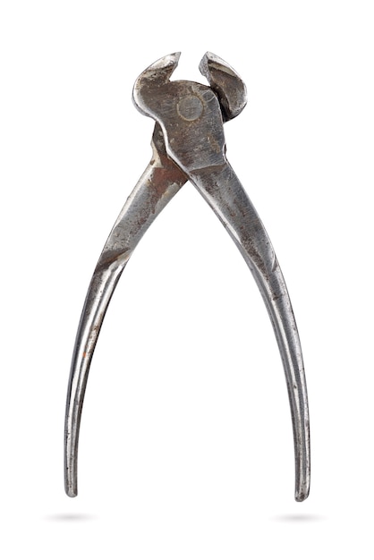 Old rusty end cutting pliers hand tool isolated on white background