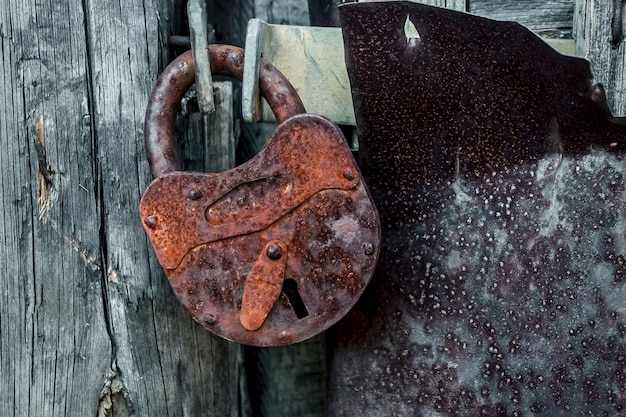 old rusty padlock on the door close