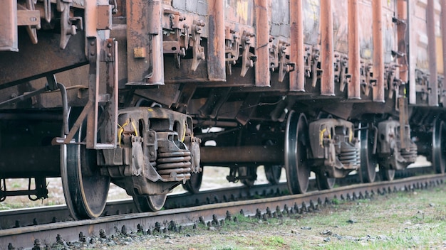 Old rusty wagons on flights. Side view, selective focus.