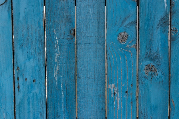 Old shabby wooden planks with cracked blue color paint, Rural country surface