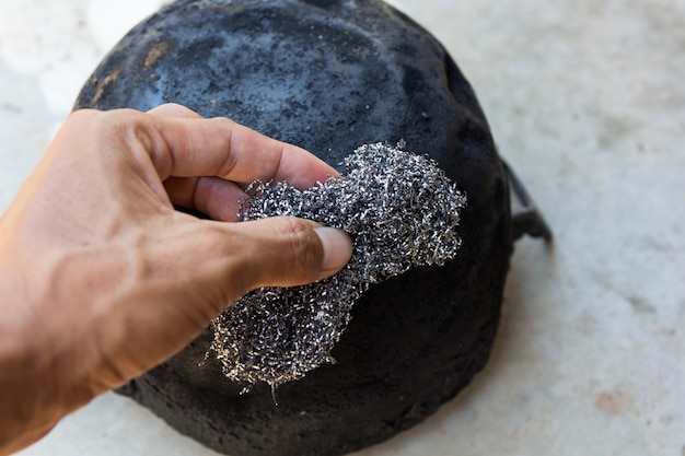 Old steel scouring pad on hand