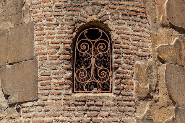 The old stone wall of the fortress with