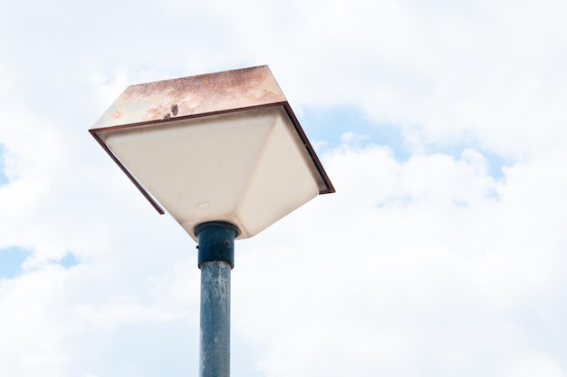 Old Street retro lamp on blue sky background