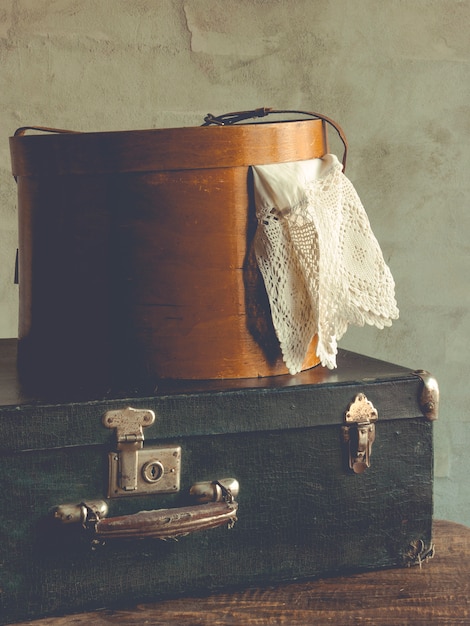 Old suitcase and a box of clothes