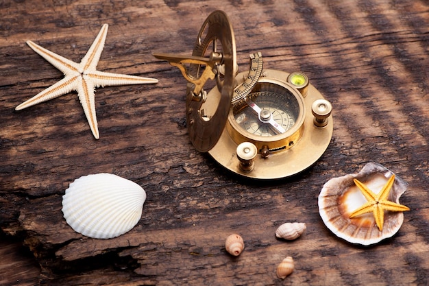 Old sundial with compass sea background