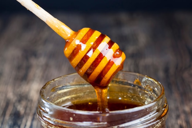 Old table on which there is a healthy and sweet bee honey