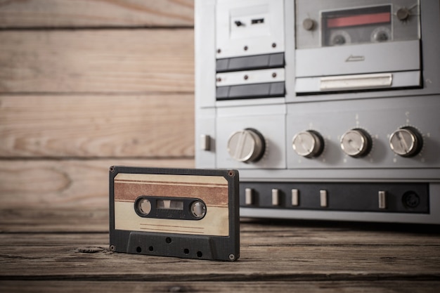 Old tape recorder and cassette on  wooden table