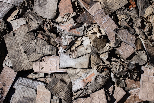 Old tiles old damaged cardboard garbage burnt cardboard and beaten tiles