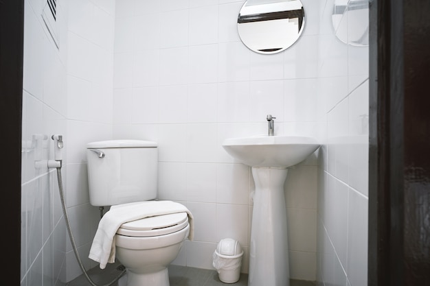 Old toilet room of apartment or small hotel with flush toilet