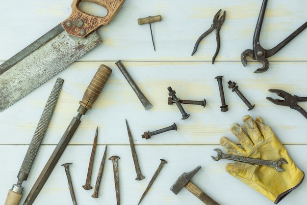 Old tools on light wooden background