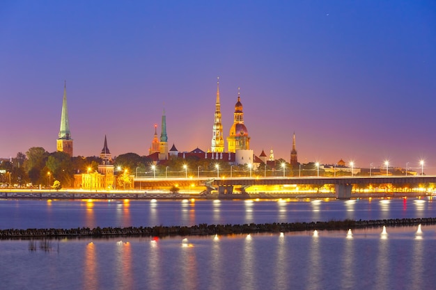 Old town of riga and river daugava at night riga cathedral saint peter church cathedral basilica of