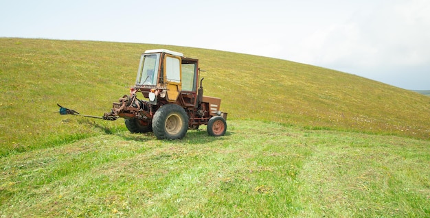 Old tractor standing in a field