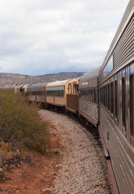 Old train cars running in desert landscape Arizona