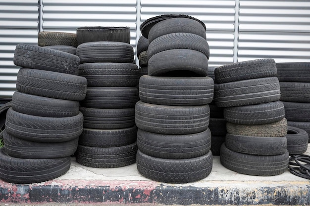 Photo old used tires stacked black piles of used tires