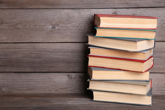 Old vintage books on grey wooden table